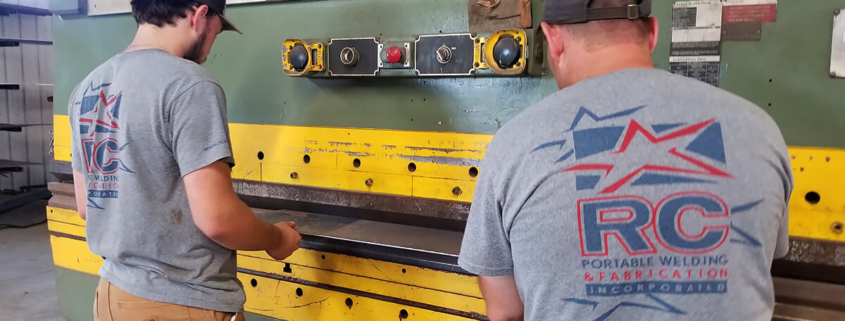 professional welding contractors working in shop